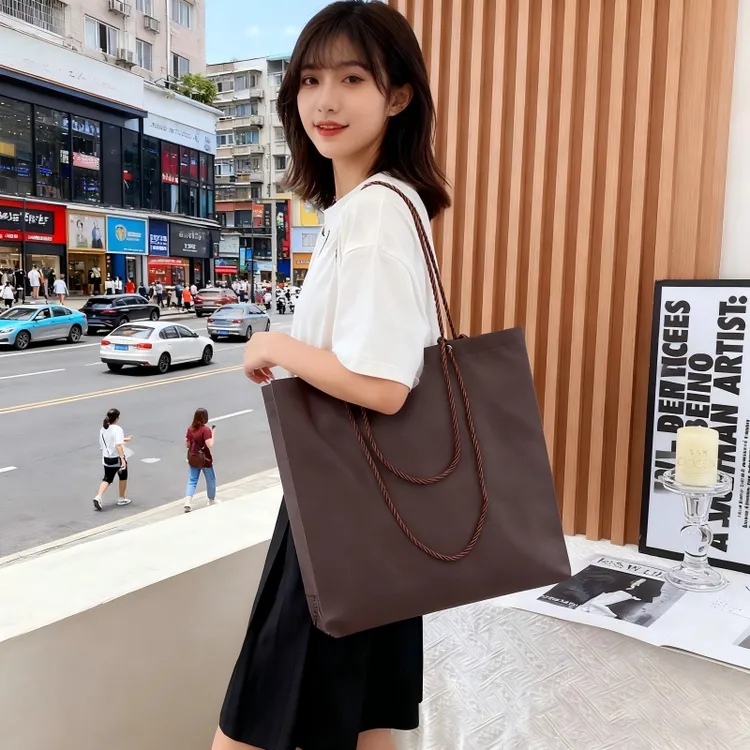 新款暗扣拉绳无纺布男女装店童装店环保礼品袋服装无纺布手提袋