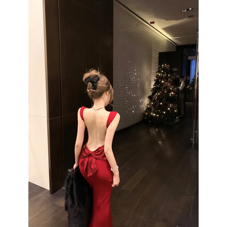 韩系气质绝美缎面蝴蝶结露背长裙女冬修身显瘦包臀吊带礼服连衣裙