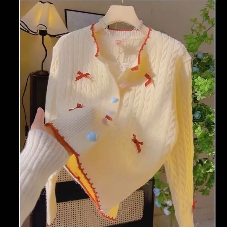 甜美奶fufu慵懒麻花毛衣外套女春秋新款设计感蝴蝶结彩扣针织开衫