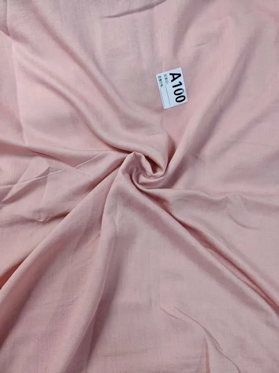 A100粉色天丝麻布面料夏季款垂感柔软多拍连裁布料