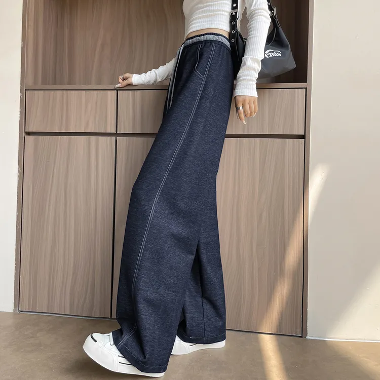 丹宁蓝弯刀阔腿牛仔裤女2025春秋新款高腰垂感宽松窄版直筒镰刀裤