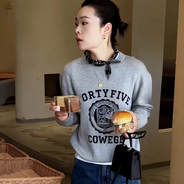 韩版高端别致设计感印花圆领卫衣女2025秋季流行风格百搭休闲上衣