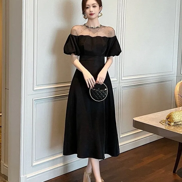 赫本风黑色连衣裙子高级感礼服气质名媛女神范泡泡袖一字肩长裙女