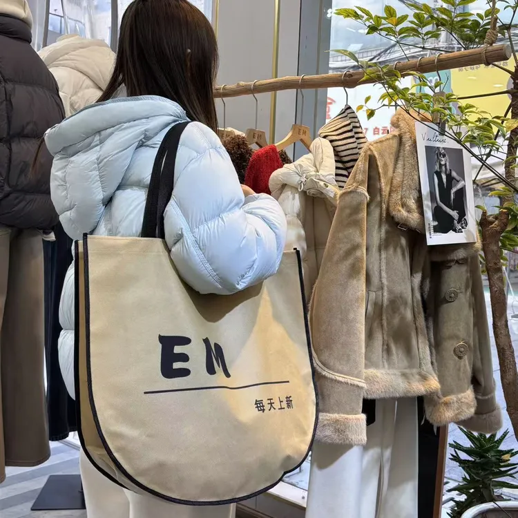 无纺布袋定做印logo服装店手提袋订制女装店月亮袋环保购物袋订做