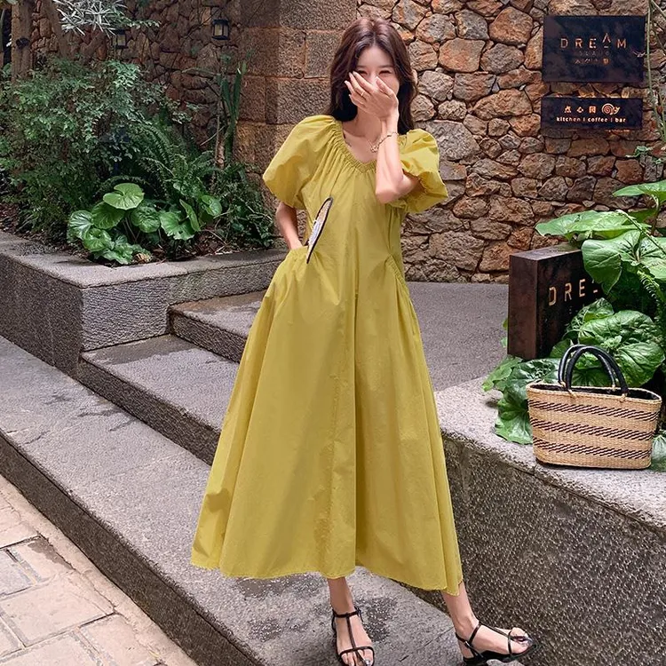 日系连衣裙收腰黄色泡泡袖2025夏季新款设计感收腰通勤显瘦长裙子