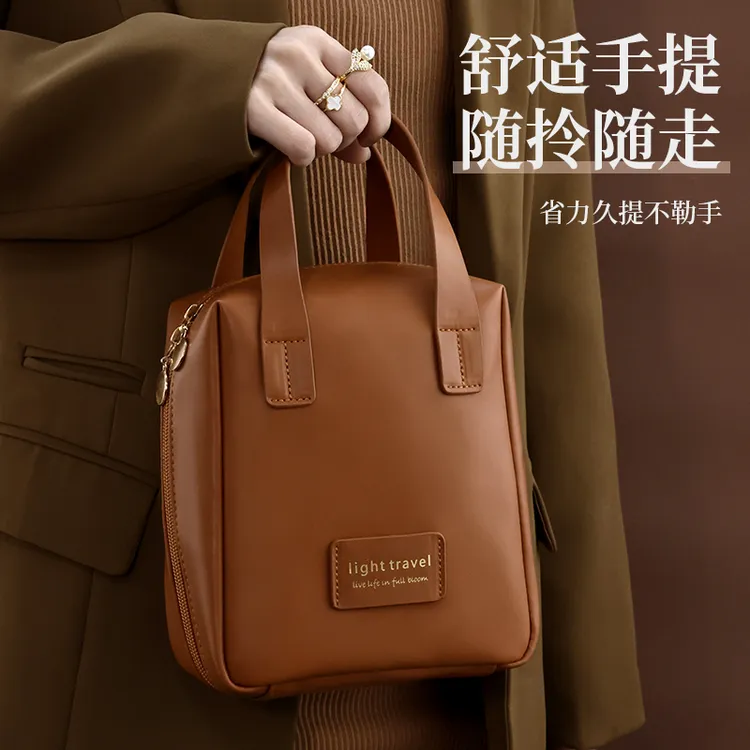 化妆包女2025新款便携式大容量高端手提袋盒护肤品收纳旅行洗漱包