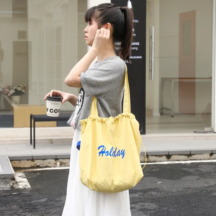韩版轻便尼龙布托特包女复古百搭字母单肩水桶包小清新手提布袋潮