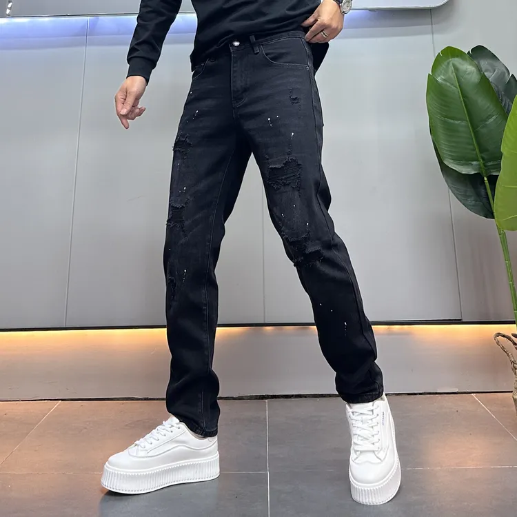 设计款破洞补丁牛仔裤男黑色秋冬新款美式休闲泼墨修身九分裤