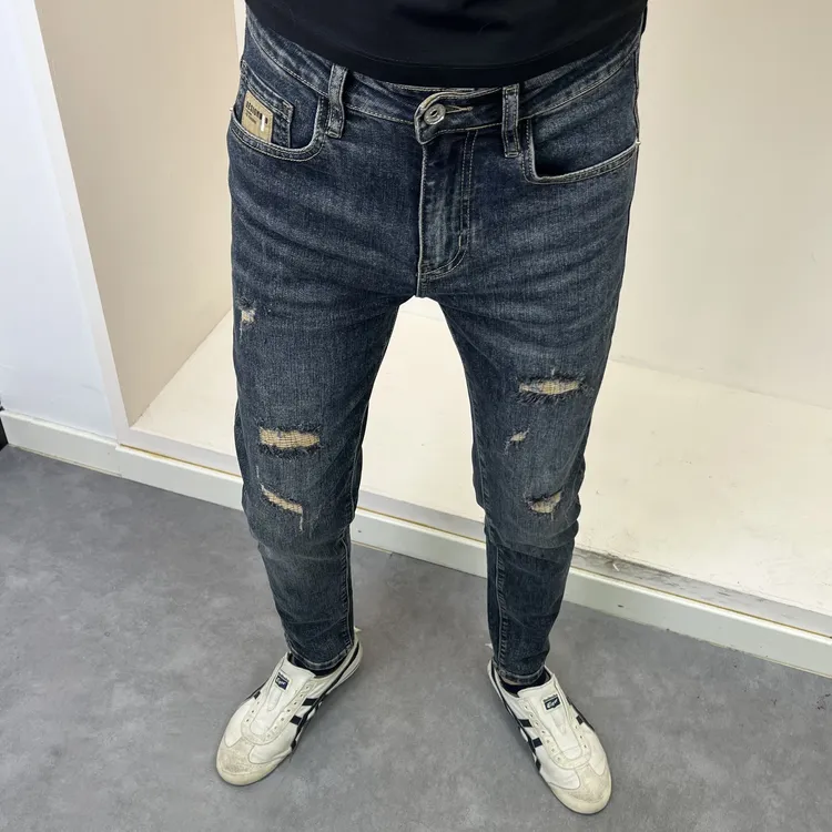 秋季新款深蓝色假破洞修身小脚男牛仔裤时尚潮流百搭痞帅弹力韩版