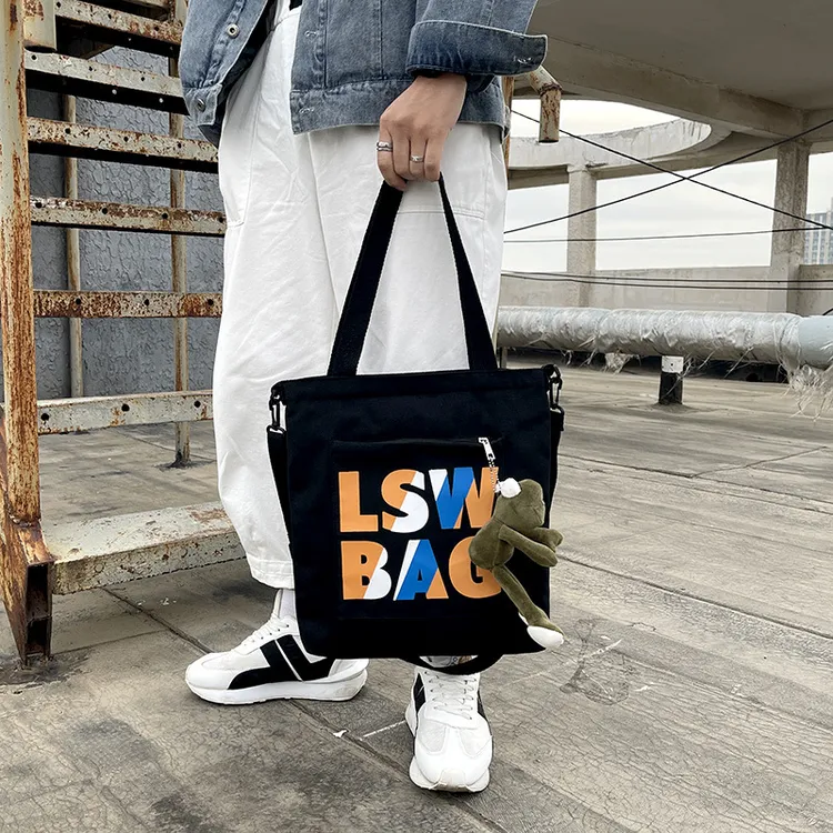网红洋气韩风国潮大学生托特包上课帆布包男女单肩托特包男包