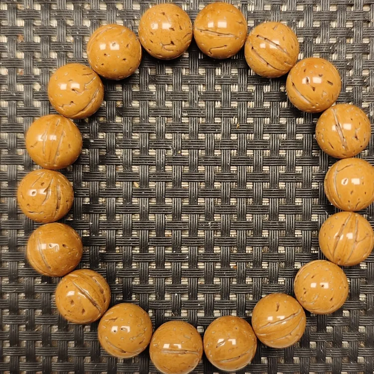 13尺寸精品野生黄皮桃核光珠手串 
