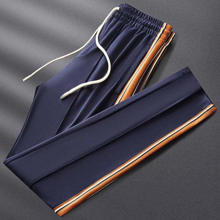 轻奢侈夏季薄款冰丝弹力运动裤男修身小脚高端拼接直筒休闲裤子男