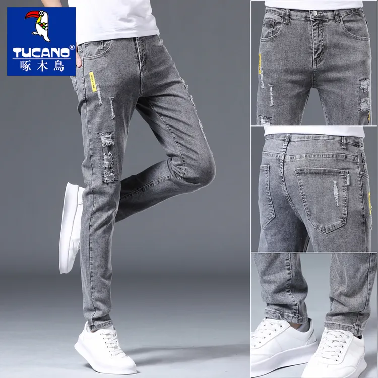啄木鸟秋季男士牛仔裤男款爆款2025新款秋冬款修身小脚破洞休闲裤