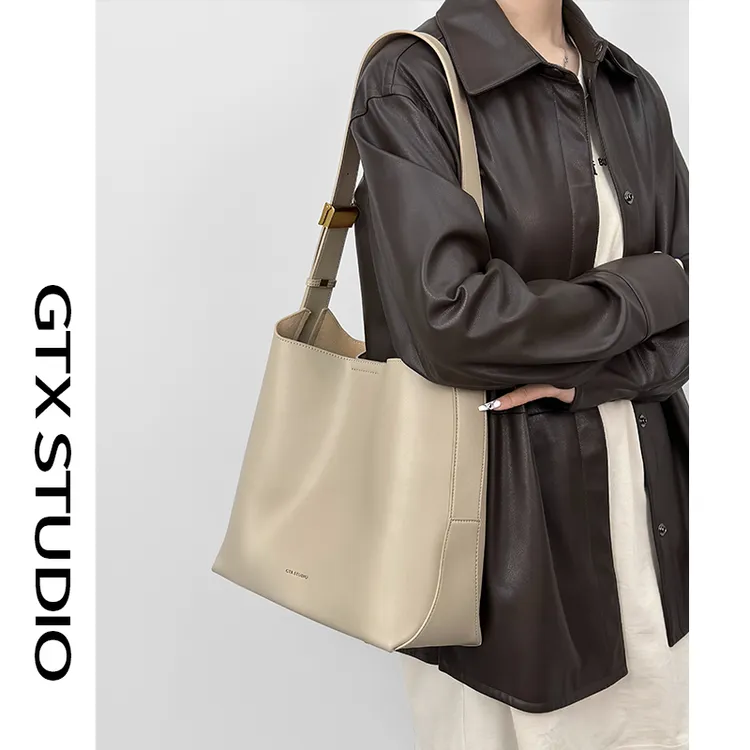 【谷田西】牛皮水桶包女2025夏季高级感通勤大容量斜挎托特包大包