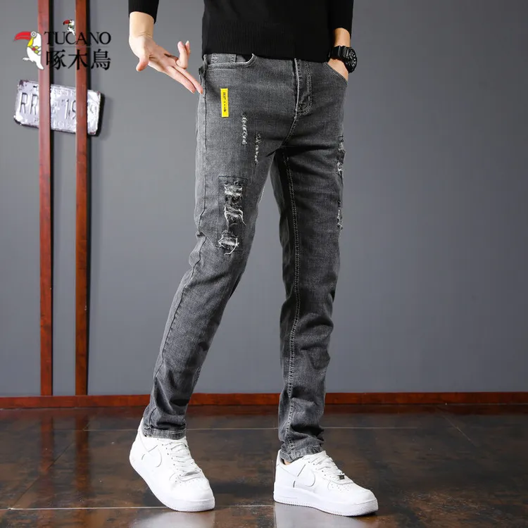 啄木鸟2025秋季新款潮牌破洞牛仔裤男韩版潮流长裤春秋款小脚男士