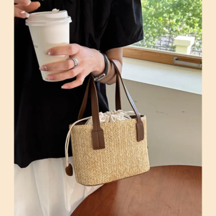 编织包包女2025春季新款手提托特包百搭度假斜挎包草编包