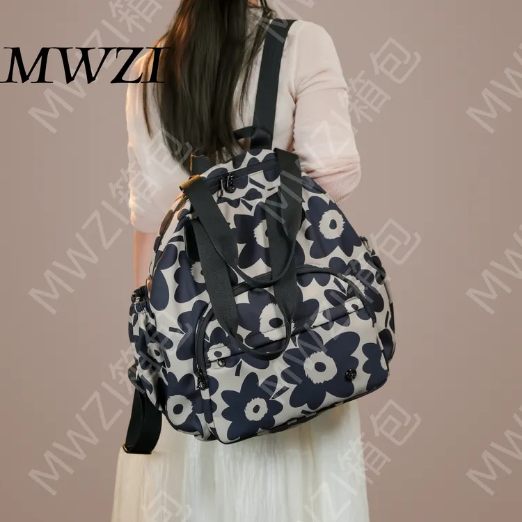 MWZI藏蓝色大花潮流背包出差妈咪包百搭大容量旅游双肩包