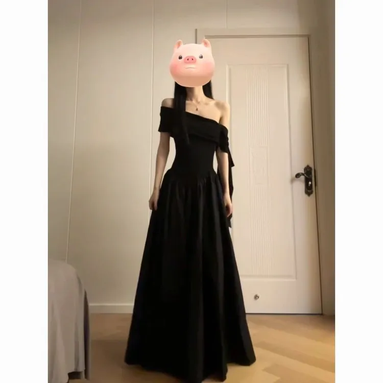 法式气质一字肩连衣裙女2025年夏季新款掐腰显瘦设计感黑色长裙子