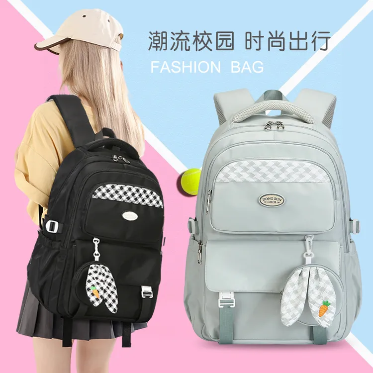 韩版初中生书包男女时尚休闲双肩包高中大学生轻便减负背包旅行包