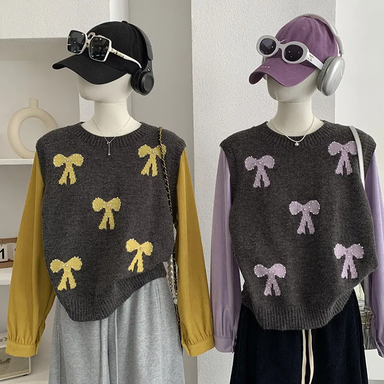 欧玛莱韩系蝴蝶结钉珠拼接袖假两件针织衫春季新款长袖毛衣