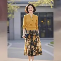 黄色针织套装2025年女装春季新款高级感系带上衣印花半身裙两件套
