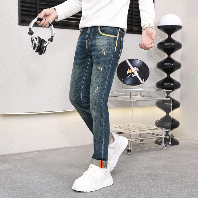 秋冬新款高端男士牛仔裤裤子手绘欧货个性时尚潮牌修身小脚牛仔裤