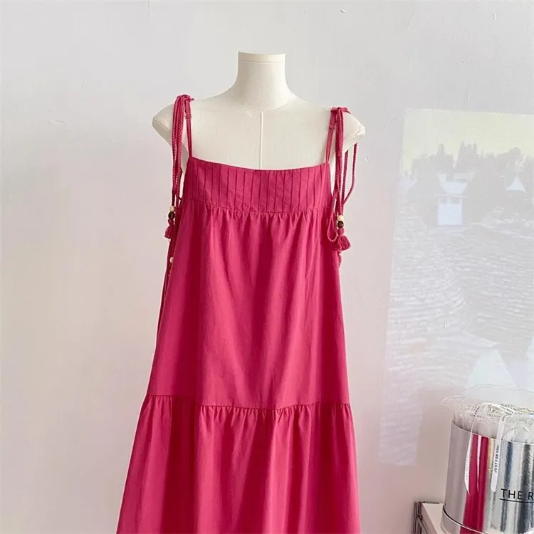 度假风流苏吊带连衣裙女夏季法式温柔粉色A字裙宽松显瘦气质长裙