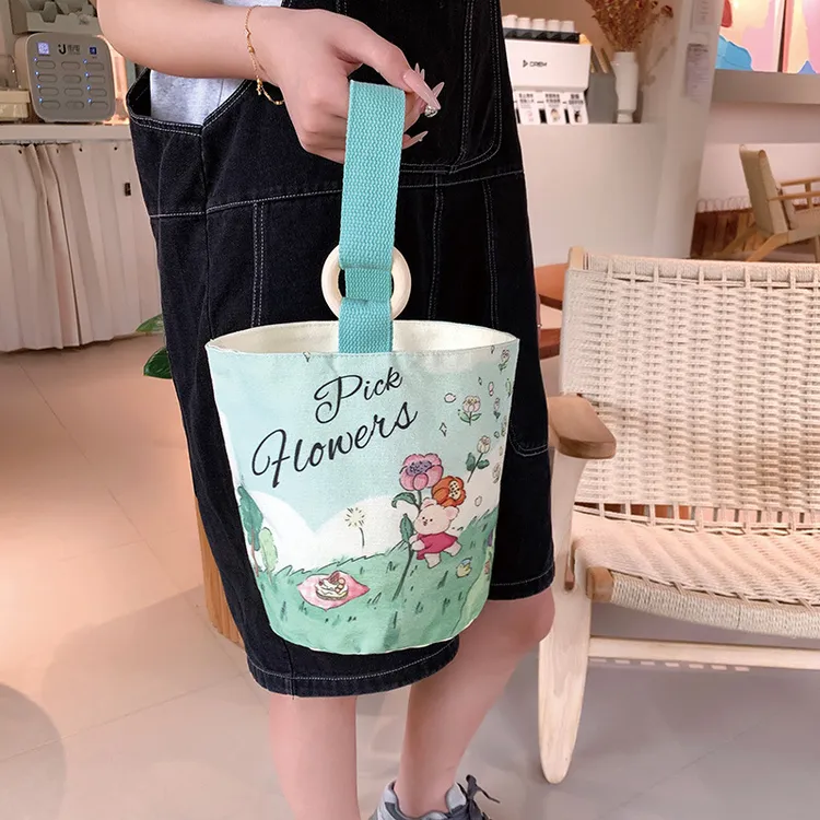 手提包女2024新款水桶包大容量通勤手提袋帆布包简约布袋包包