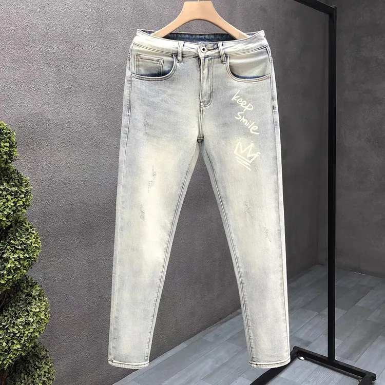 流行浅色水洗简约牛仔裤破洞男痞帅青年长裤夏季新款韩版修身裤子