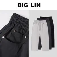 BIG林秋季立体剪裁铆钉软壳水洗休闲潮流百搭抽绳简约弯刀长裤