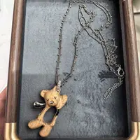 E608咖色木头小熊长款项链