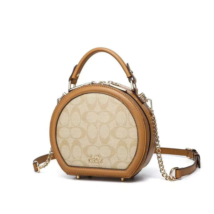 香港品牌真皮手提圆饼包包女2025新高级感夏天时尚单肩斜挎小圆包