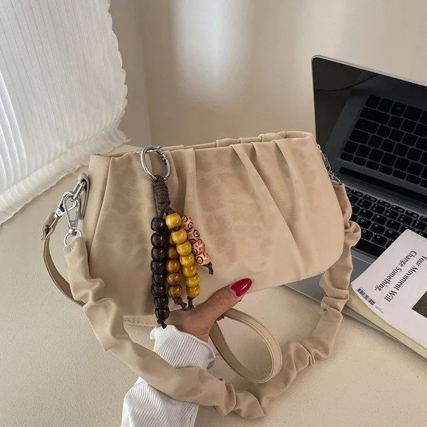 独特小众豹纹包包女2025秋冬季新款复古斜挎包超火褶皱单肩腋下包