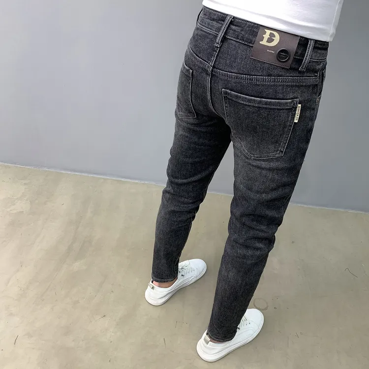 水洗黑色牛仔裤男秋冬新款九分时尚刺绣复古韩版修身弹力小脚长裤