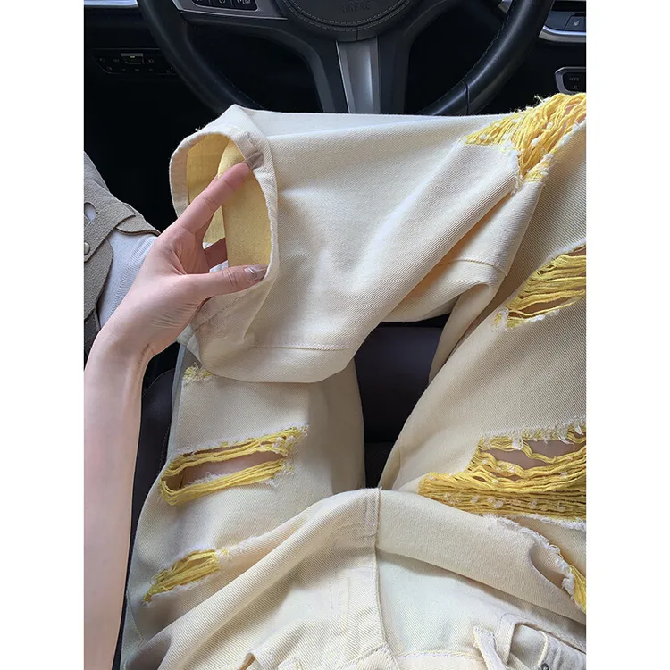 设计感黄色破洞牛仔裤女2025夏季薄款高街显瘦小众辣妹乞丐阔腿裤