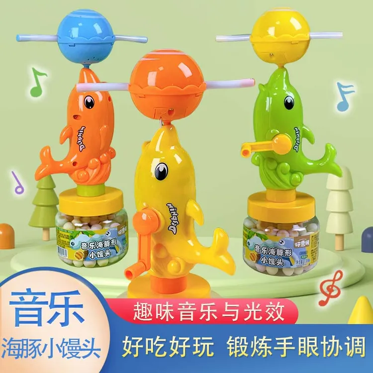 果蔬小馒头发光音乐手摇旋转海豚玩具小奶豆夜市地摊幼儿园礼品