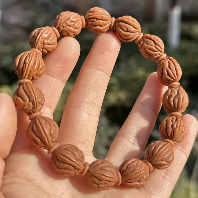 秦岭野生龙纹桃核油蜡皮高桩钱袋子野生桃核手串人工采摘精挑精卡