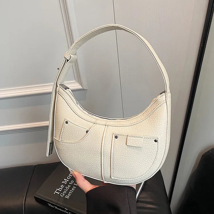 高级感小众包包女2025新款夏季百搭单肩腋下包时尚超火手提牛角包