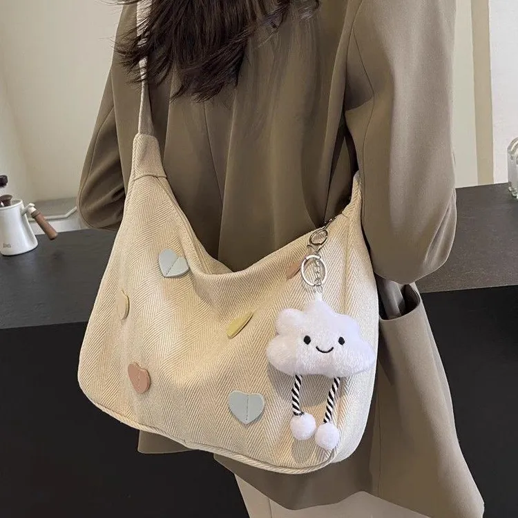 帆布包女2025新款潮秋冬简约百搭大容量单肩包休闲通勤斜挎饺子包