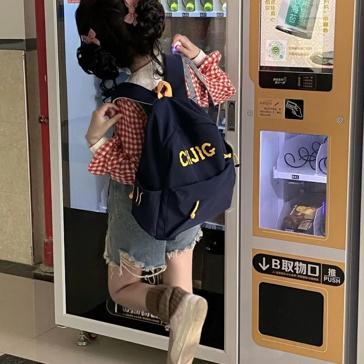 小众高颜值女生书包初中学生美系简约大容量休闲初中生双肩包ins
