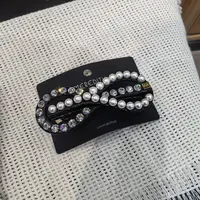 B012黑色蝴蝶结白珠闪闪高级款弹簧夹