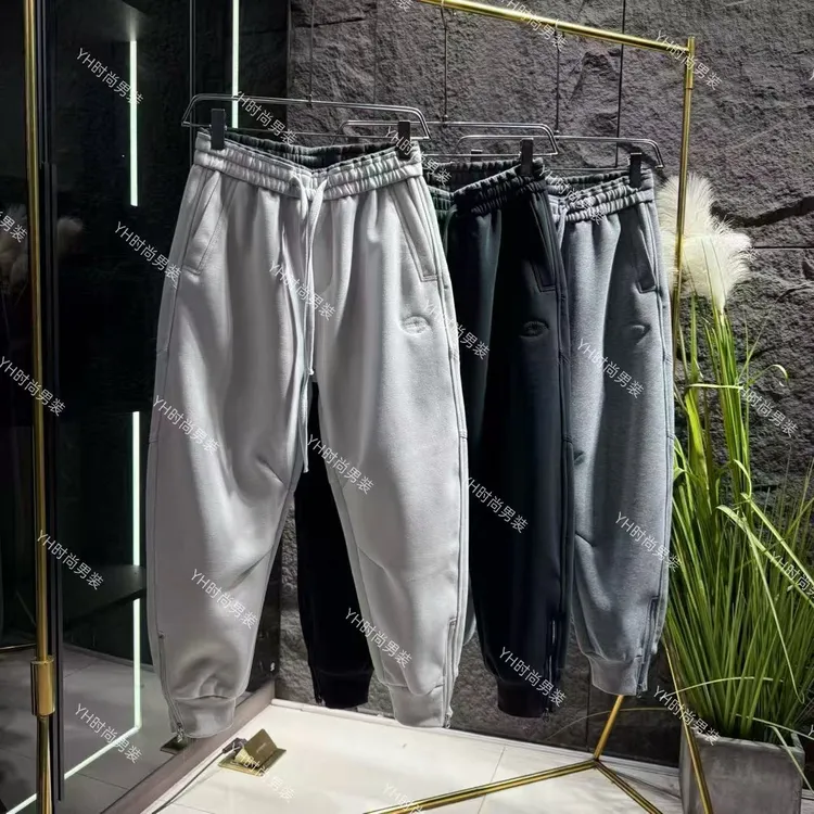 冬季新款时尚潮牌立体剪裁弯刀拉链卫裤宽松休闲百搭保暖男士长裤