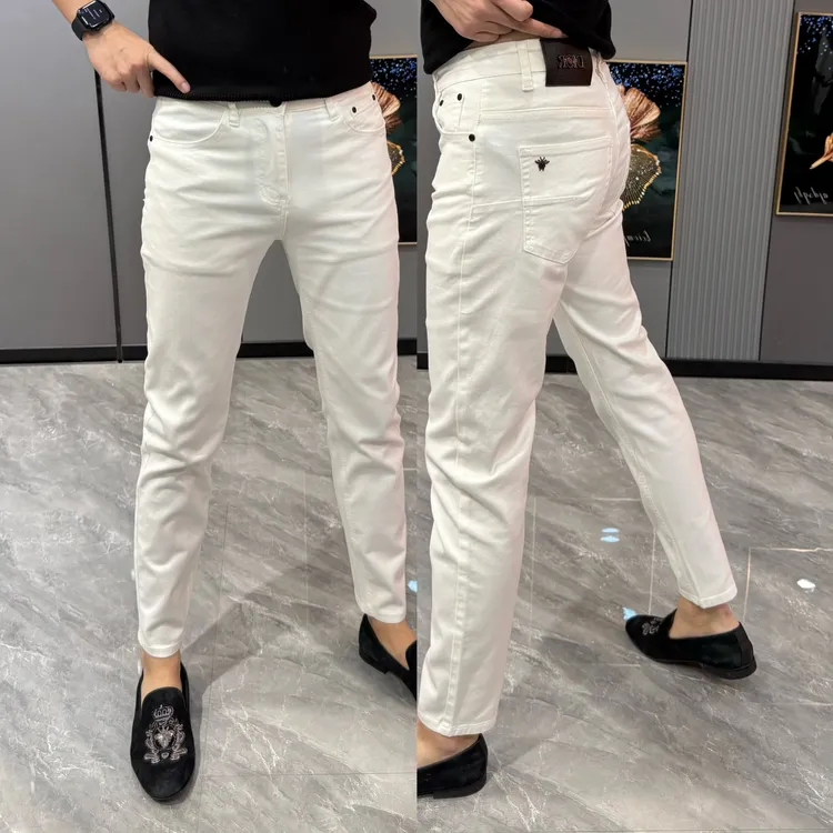 男士牛仔裤潮流韩版男裤修身弹力小脚裤早春新款高端百搭白色长裤