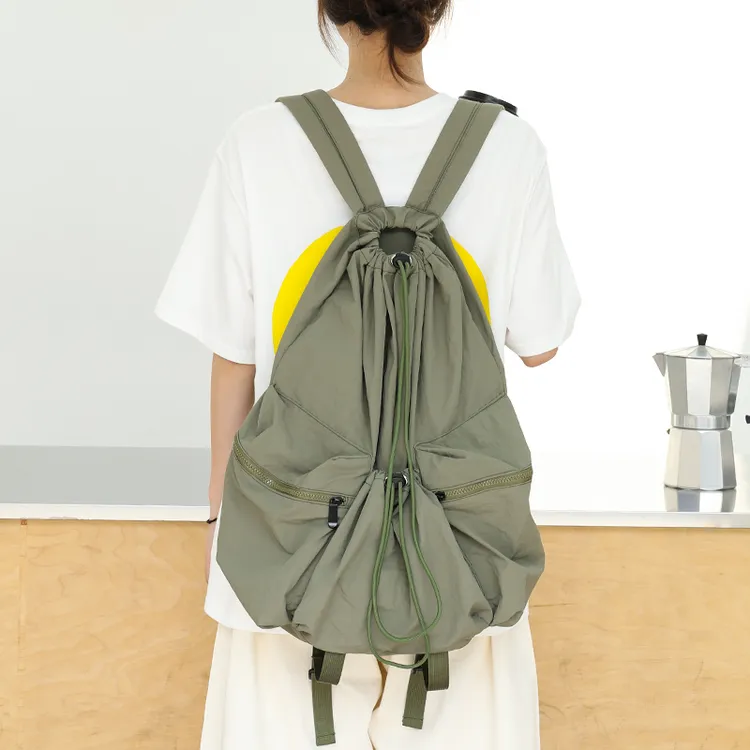 韩版牛津布水桶包运动休闲尼龙双肩包日常大容量旅行通勤抽绳背包