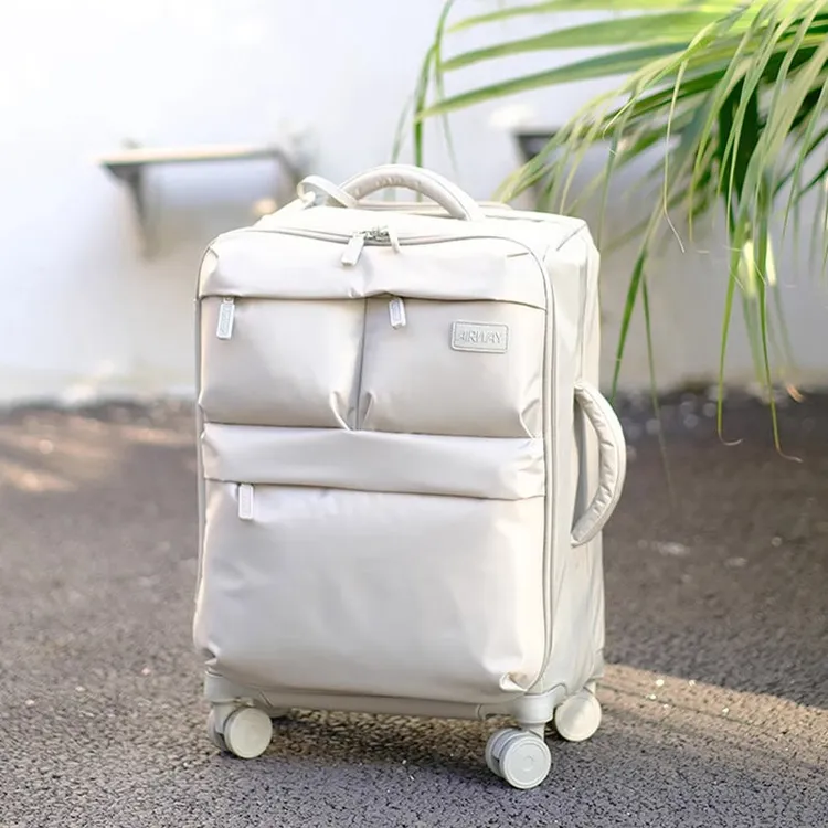 新款出口日本超轻牛津布旅行箱男多口袋静音万向轮20寸登机防水女