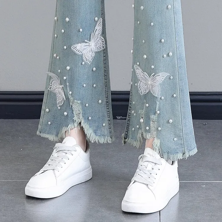 毛边蝴蝶结微喇牛仔裤女2025春季新款高腰显瘦不规则九分喇叭裤