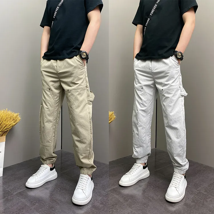 纯色铆钉拼接设计工装休闲裤男2025秋季款韩版百搭宽松束脚哈伦裤