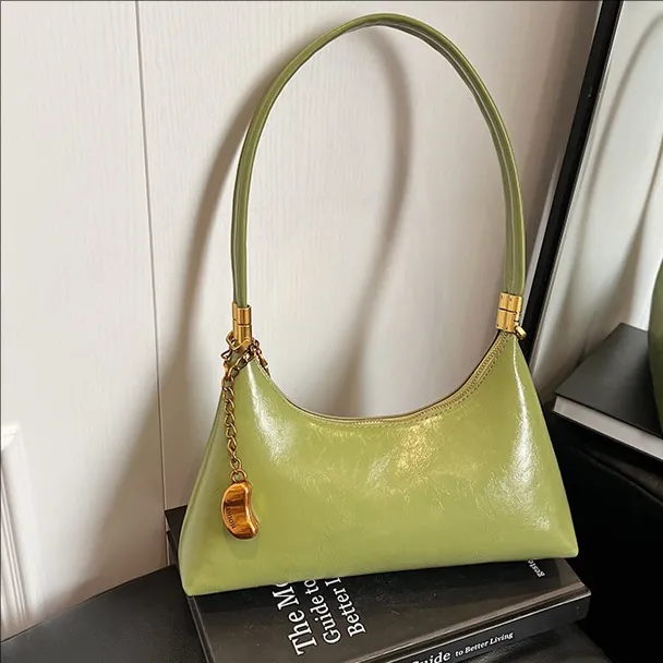 高级感复古法棍手提腋下包女2025新款时尚月牙包通勤单肩斜挎包