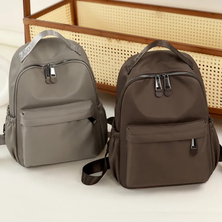 双肩包旅游帆布背包女轻便大容量休闲潮流轻便学院风电脑包牛津布