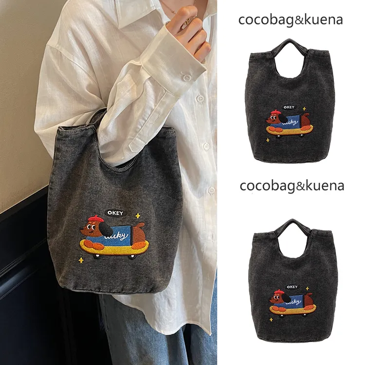 秋冬季大容量通勤水桶包包女2025新款可爱小狗刺绣手提包牛仔布包